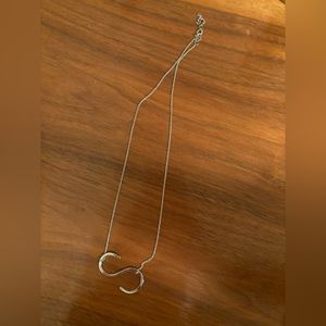 Letter S necklace.